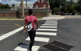 Nils crossing the street in the middle of the crosswalk 4 1