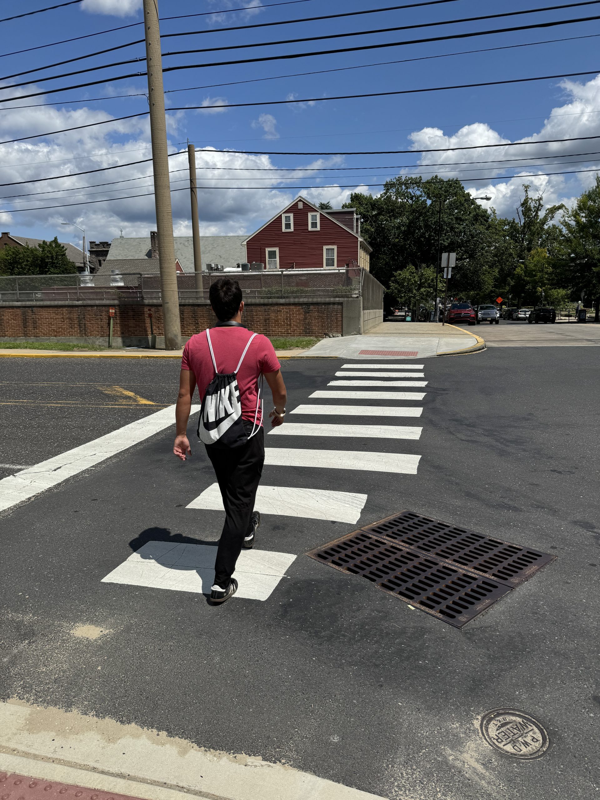 Nils crossing the street in the middle of the crosswalk 4 1 scaled